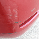 Bumper with paint damage and scuffs